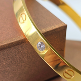 SCREW AND STONE HINGED BANGLE