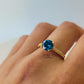 4 CLAW ROUND BLUE TOPAZ RING