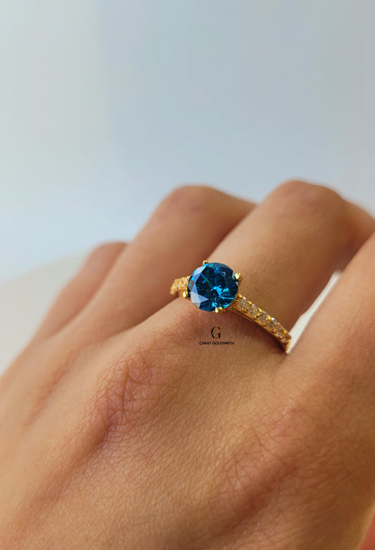 4 CLAW ROUND BLUE TOPAZ RING