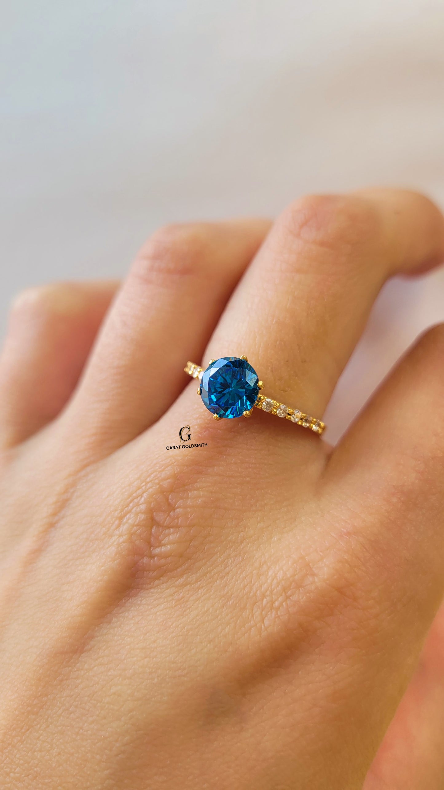 6 CLAW ROUND BLUE TOPAZ RING