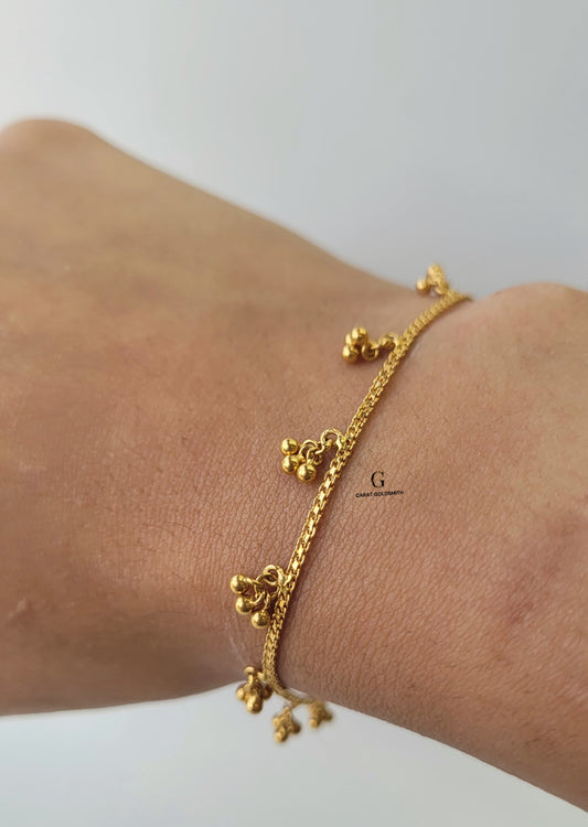 DANGLING GOLD CHARM BRACELET