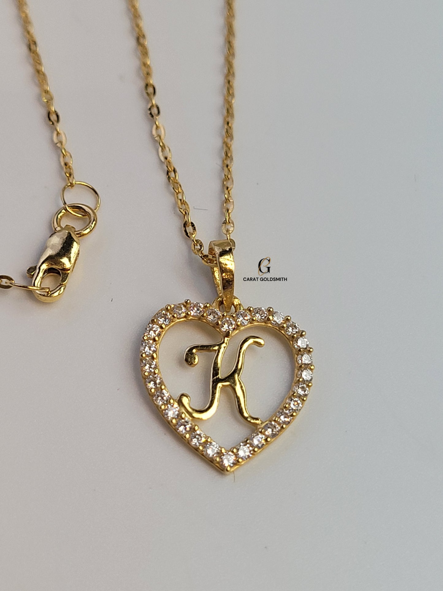 K STONE SCRIPT INITIAL HEART PENDANT