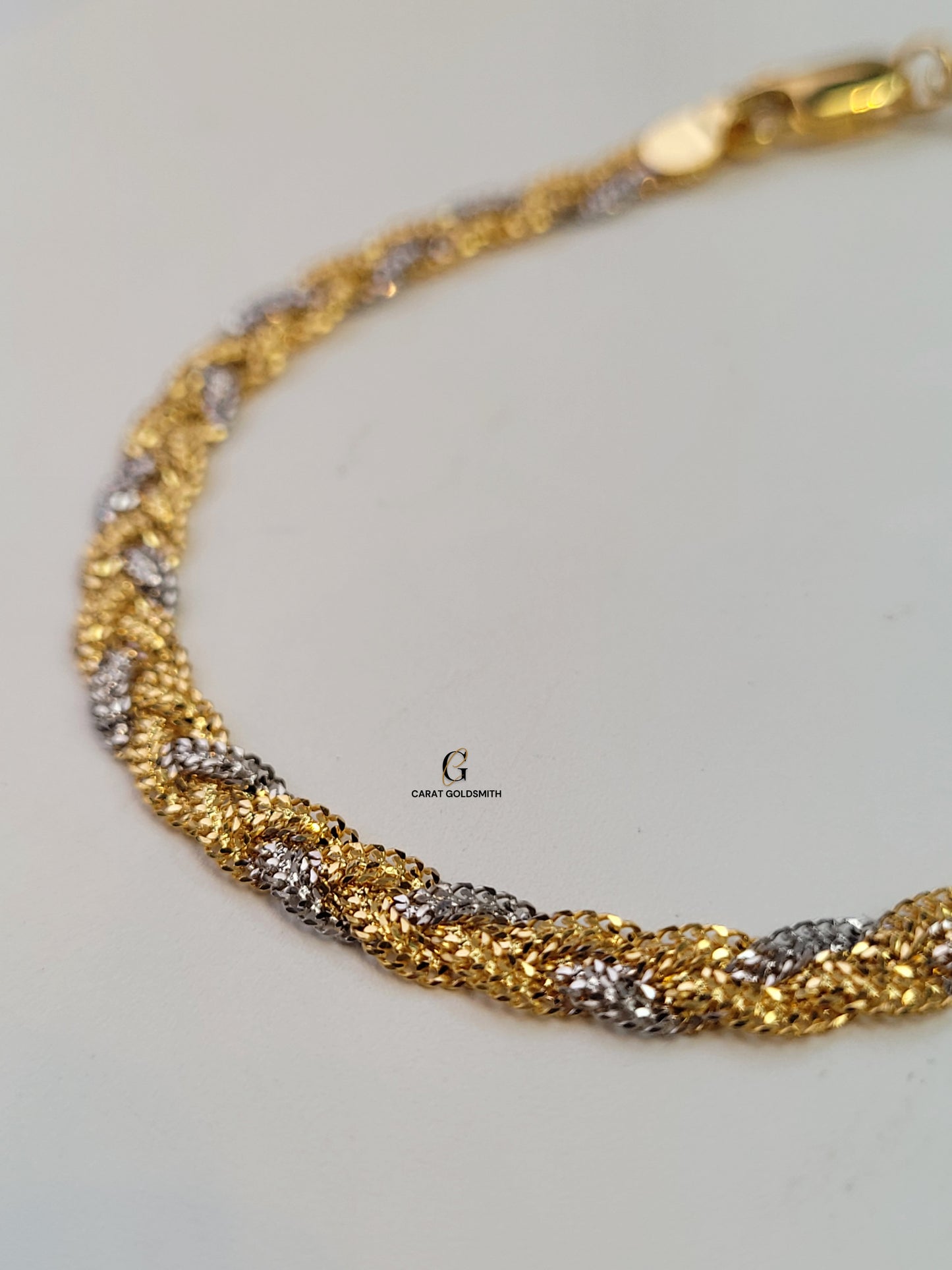 RHODIUM AND GOLD BRAIDED BRACELET