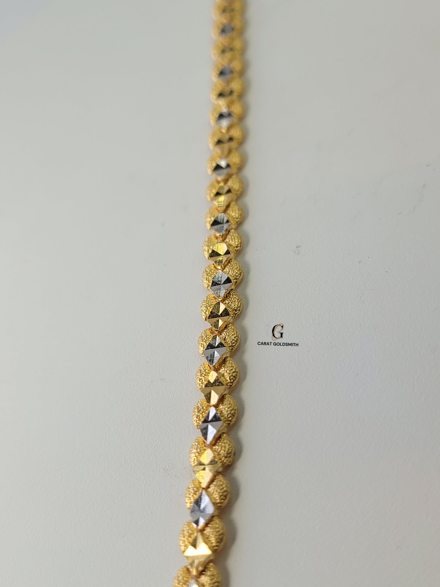 GOLD AND RHODIUM DIAMOND CUT BRACELET