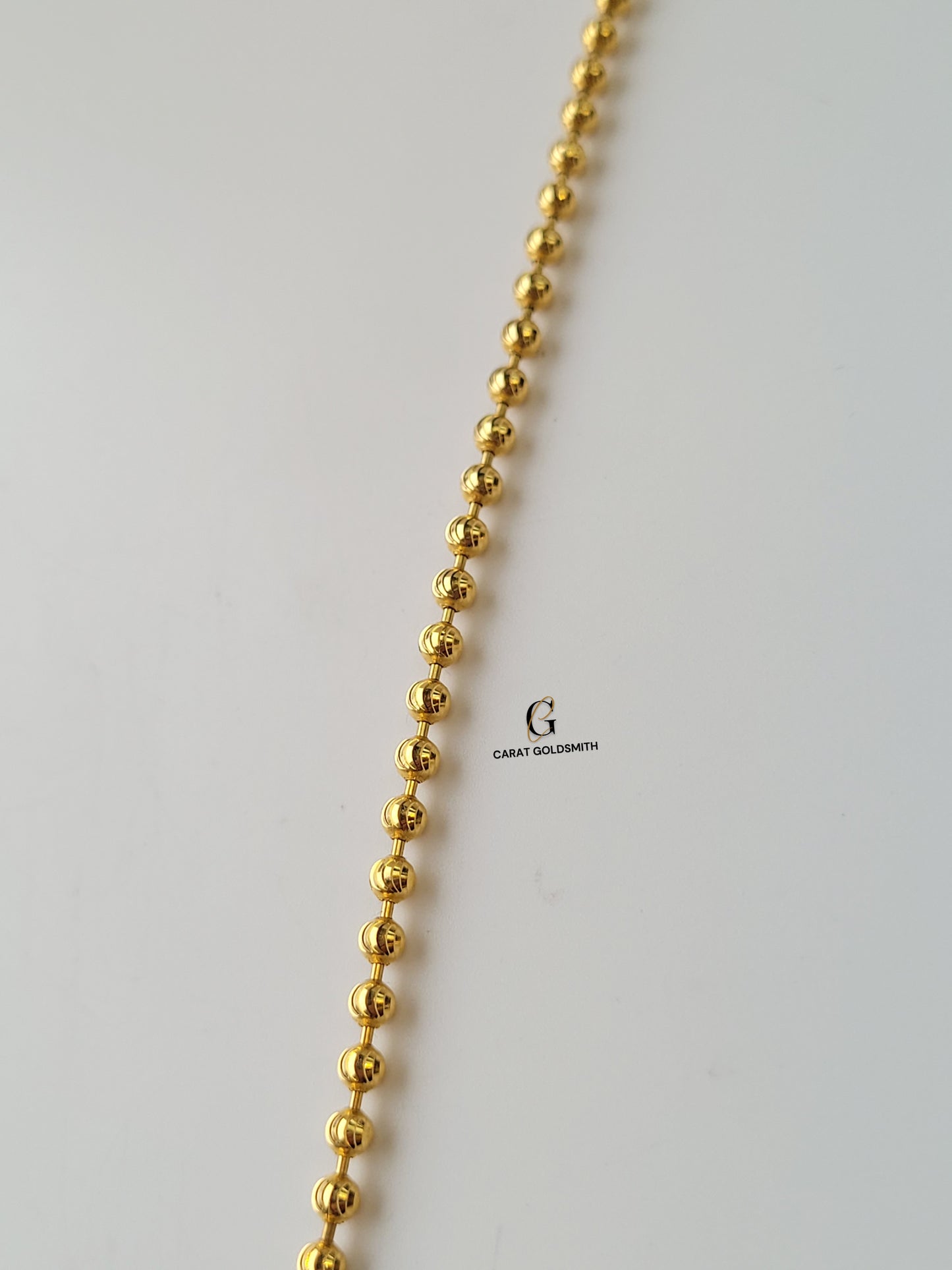 GOLD BEADED BRACELET WITH HEART CHARM