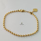 GOLD BEADED BRACELET WITH HEART CHARM