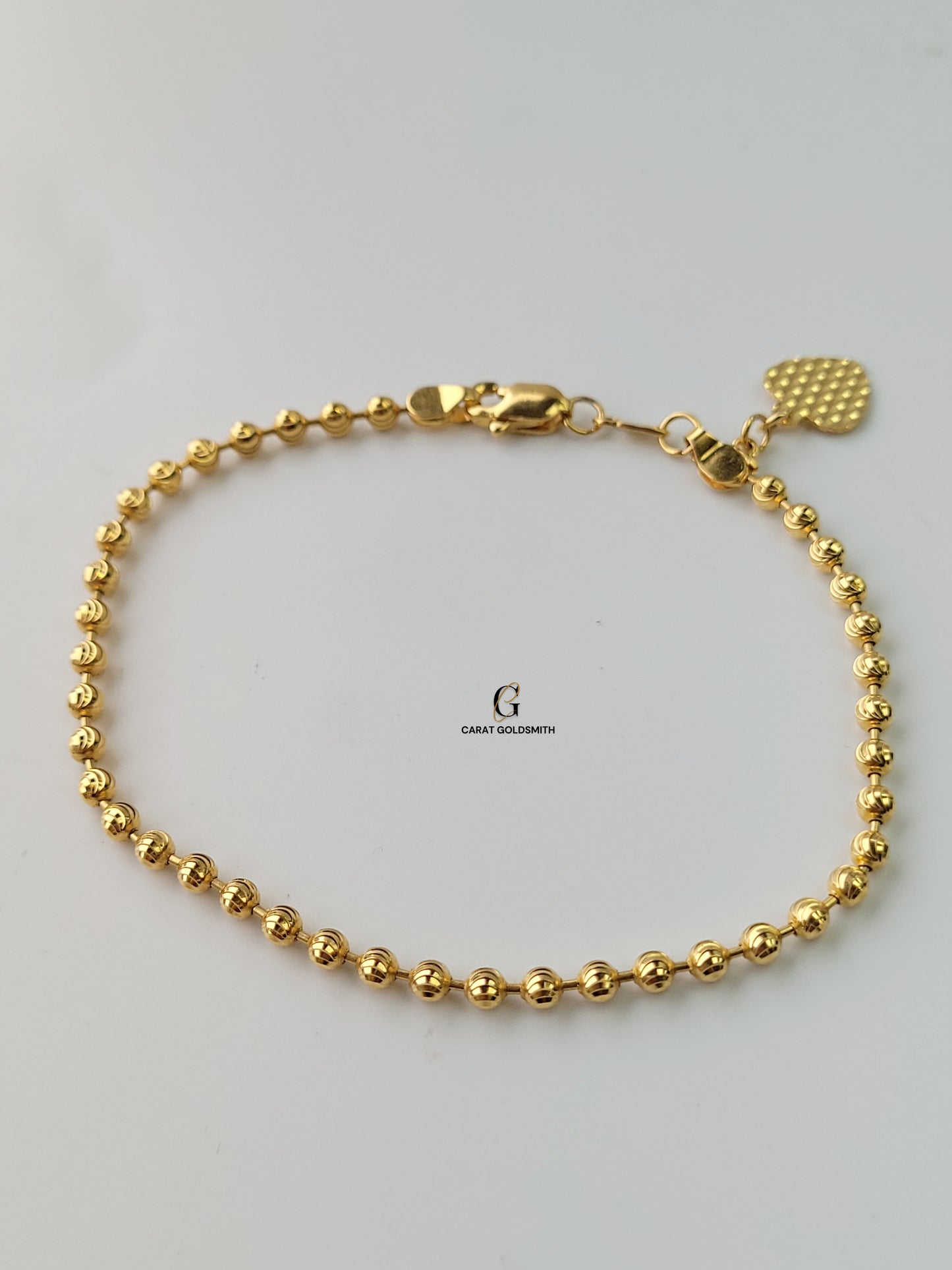 GOLD BEADED BRACELET WITH HEART CHARM