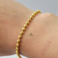 GOLD BEADED BRACELET WITH HEART CHARM