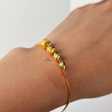 GOLD SWIRL BEADED BRACELET