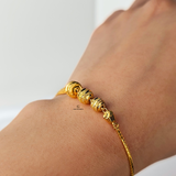 GOLD SWIRL BEADED BRACELET