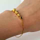 GOLD SWIRL BEADED BRACELET