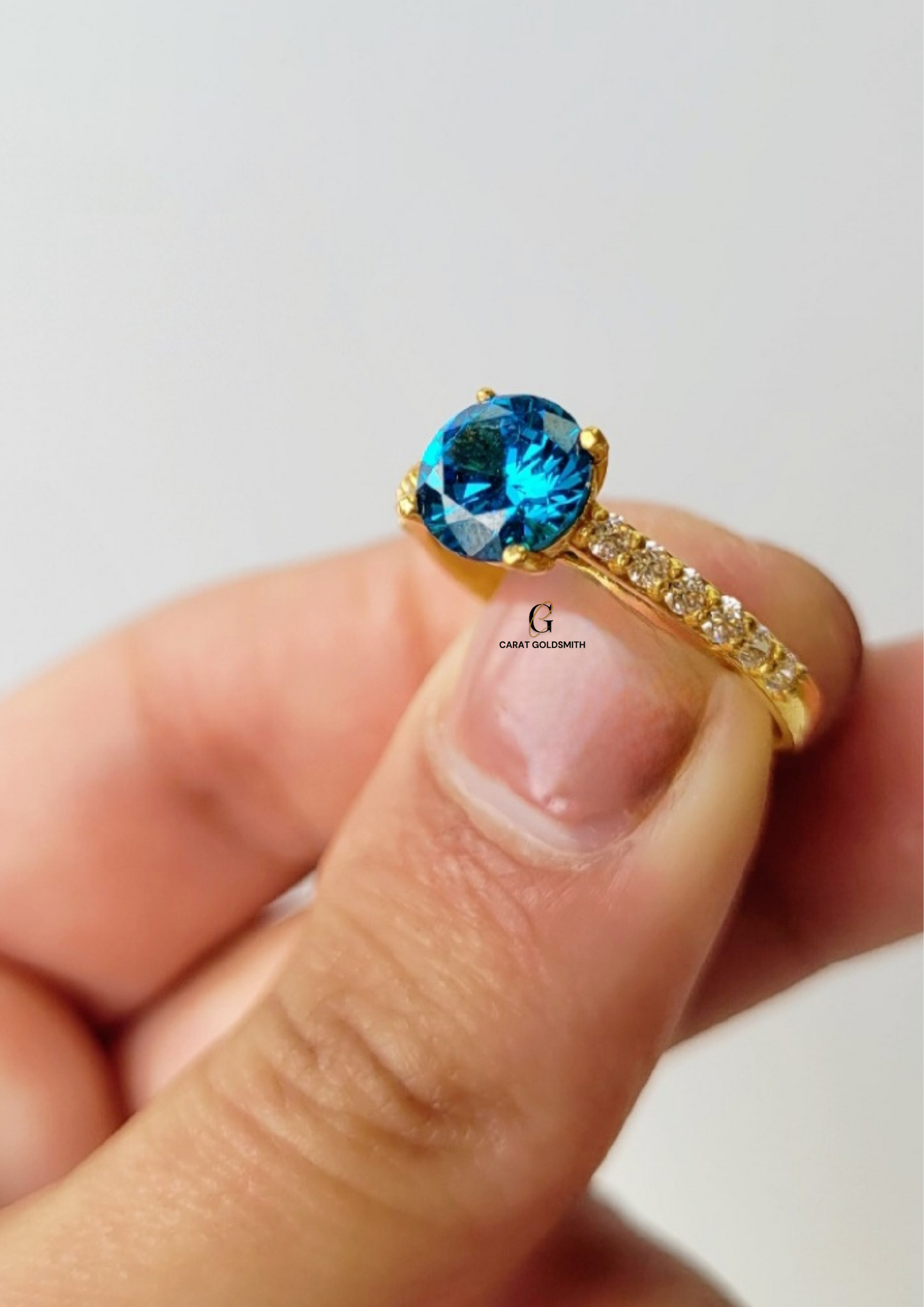 4 CLAW ROUND BLUE TOPAZ RING