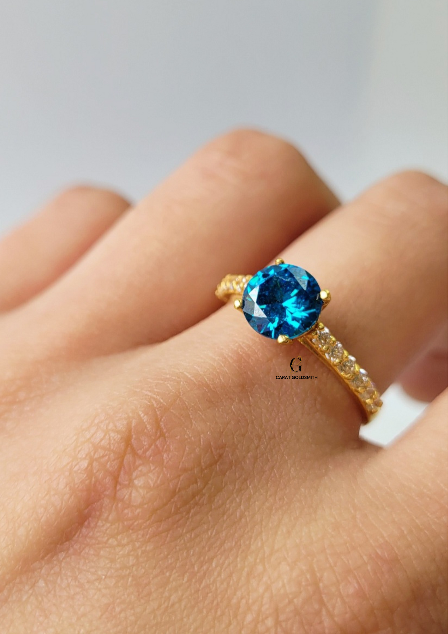 4 CLAW ROUND BLUE TOPAZ RING