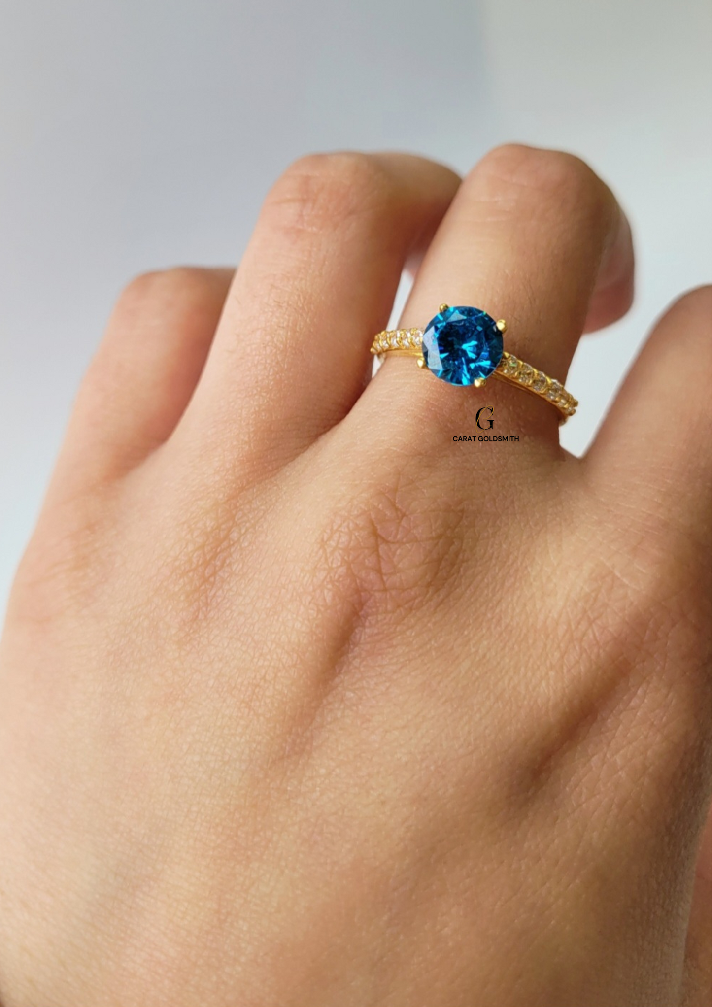 4 CLAW ROUND BLUE TOPAZ RING