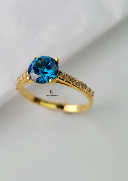 4 CLAW ROUND BLUE TOPAZ RING