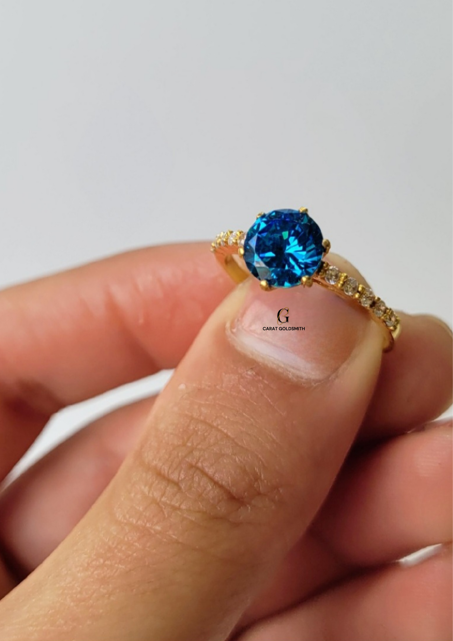 6 CLAW ROUND BLUE TOPAZ RING