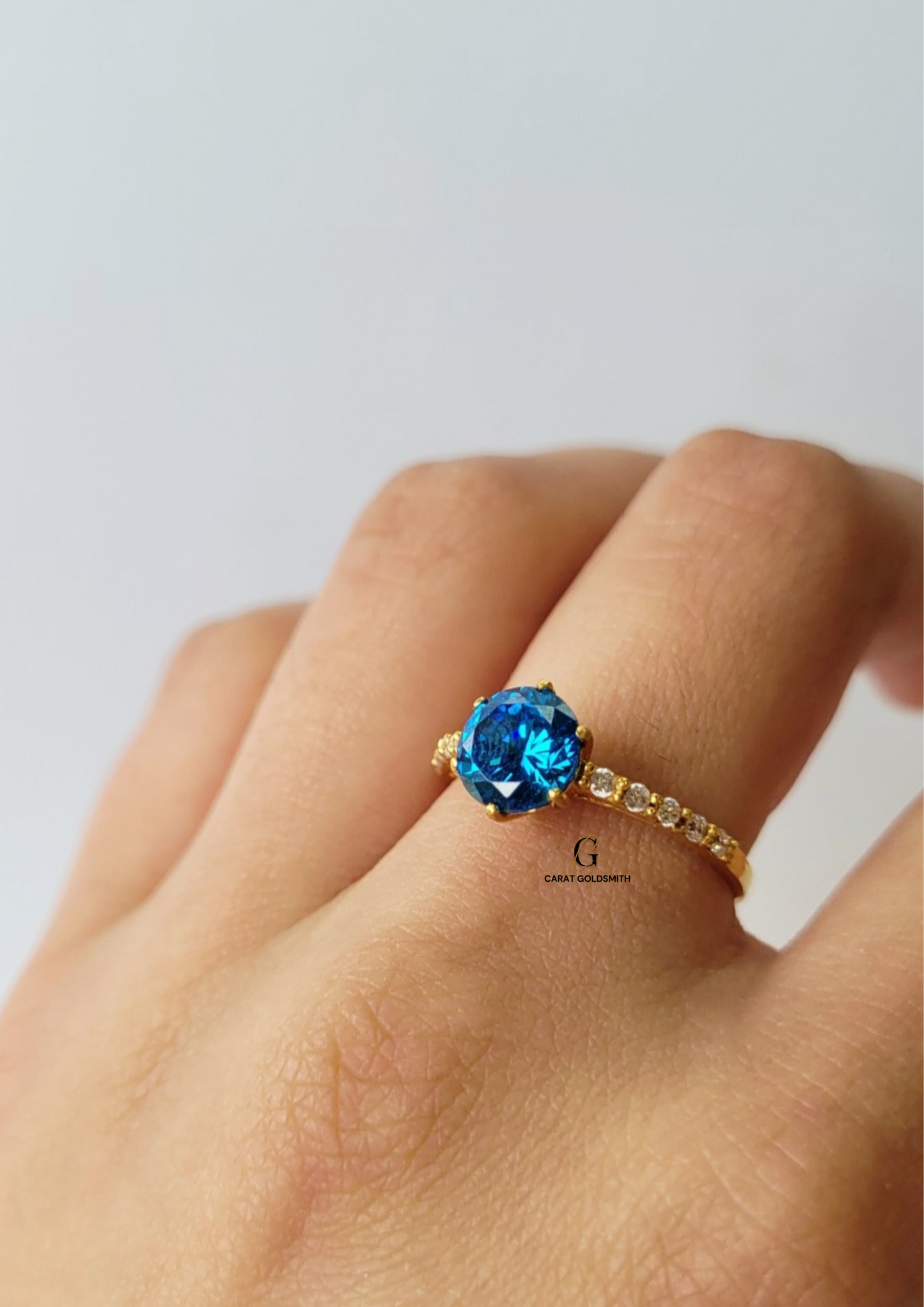 6 CLAW ROUND BLUE TOPAZ RING