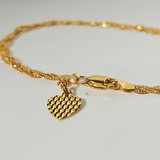 BRAIDED BRACELET WITH CHARM