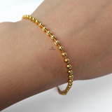 GOLD BEADED BRACELET WITH HEART CHARM