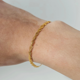 BRAIDED BRACELET WITH CHARM