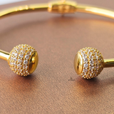 GOLD OPEN TORGUE BANGLE