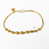 GOLD BRACELET WITH DIAMOND CUT BEADS
