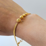 GOLD SWIRL BEADED BRACELET