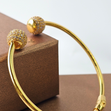 GOLD OPEN TORGUE BANGLE