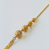 GOLD SWIRL BEADED BRACELET