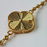 GOLD SINGLE FLOWER BRACELET - MEDIUM