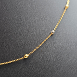 GOLD AND RHODIUM BEADED CHAIN