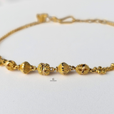 GOLD BRACELET WITH DIAMOND CUT BEADS