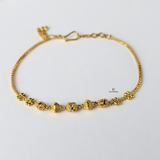 GOLD BRACELET WITH DIAMOND CUT BEADS
