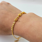 GOLD BRACELET WITH DIAMOND CUT BEADS