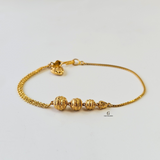 GOLD SWIRL BEADED BRACELET