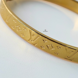 LV MONOGRAM HINGED BANGLE