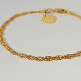 BRAIDED BRACELET WITH CHARM