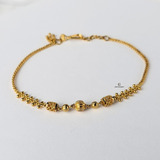 GOLD BRACELET WITH DIAMOND CUT BEADS