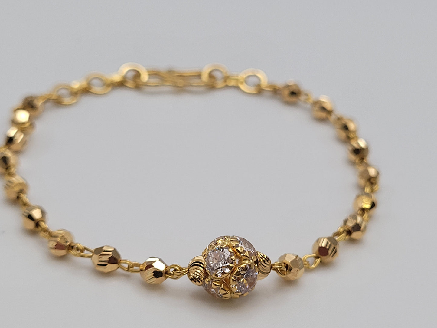 GOLD BRACELET WITH CUBIC ZIRCONIA STONE BALL